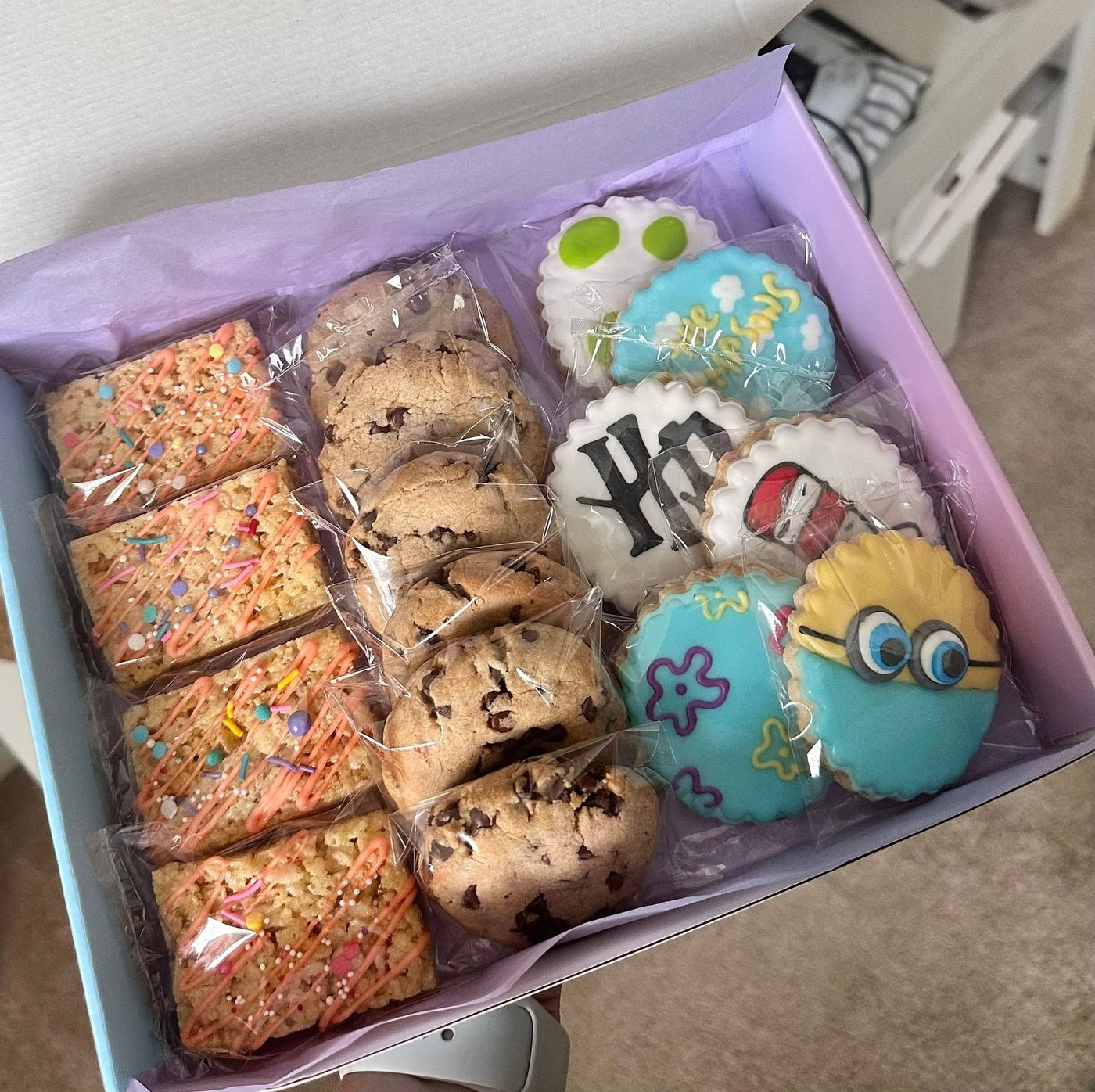Travel agent treat box with decorated cookies