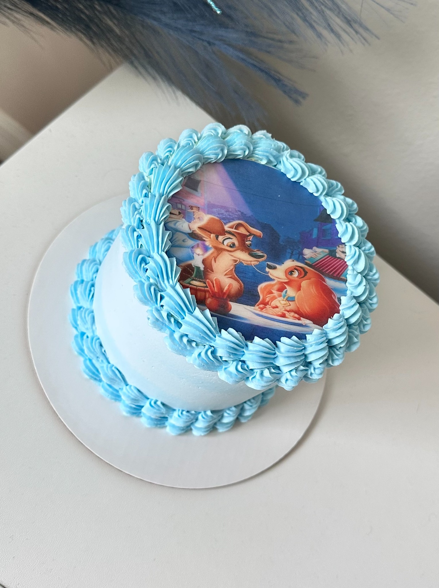 Blue cake with Lady and the Tramp image