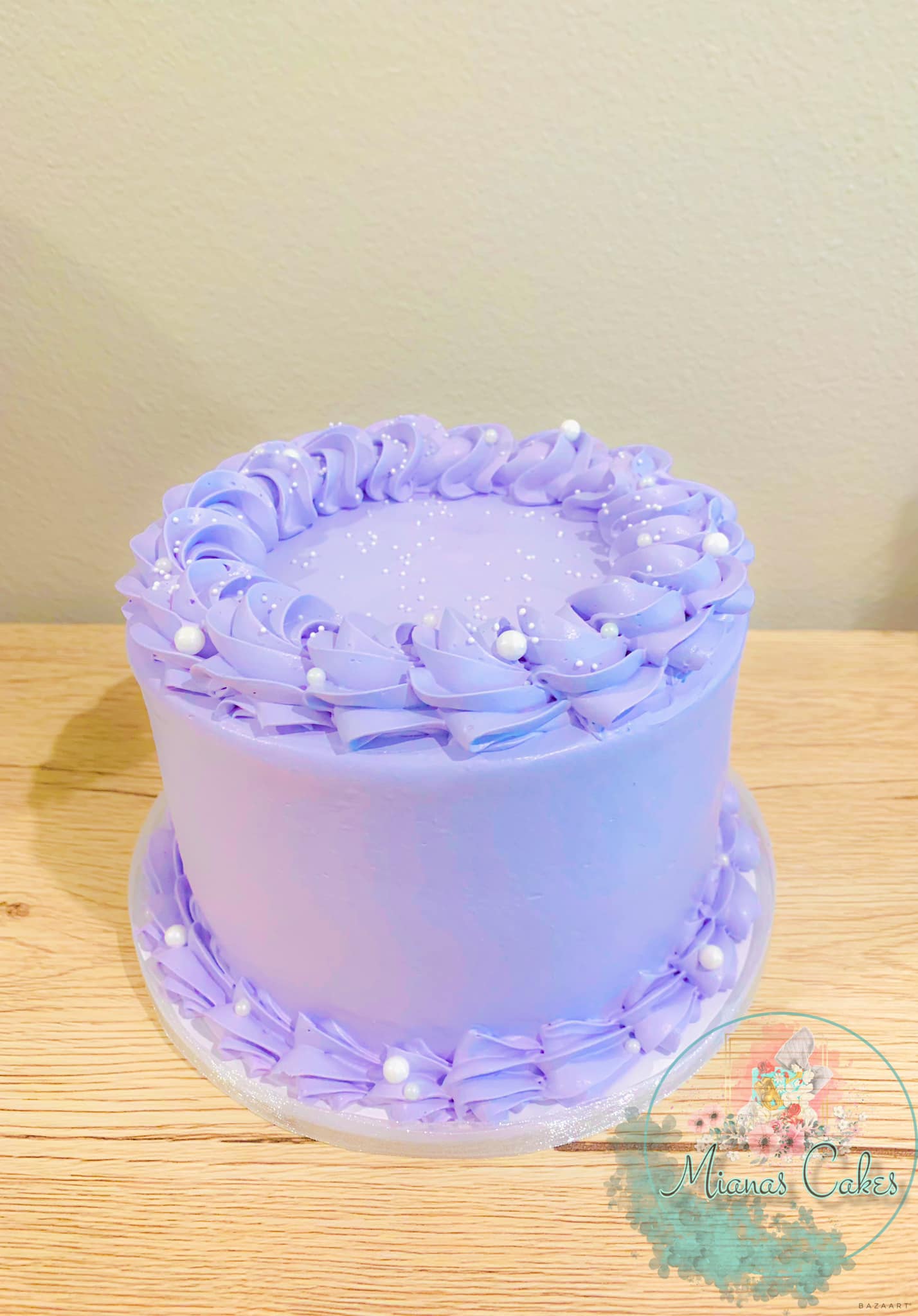 Lavender cake with piped border and pearls