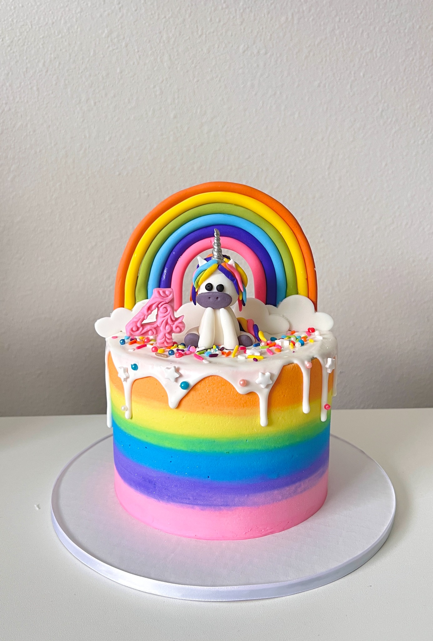 Rainbow unicorn cake with topper