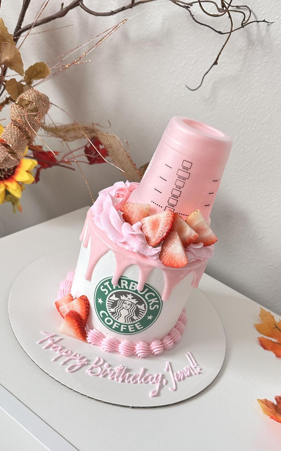 Pink coffee cup shaped cake with strawberries
