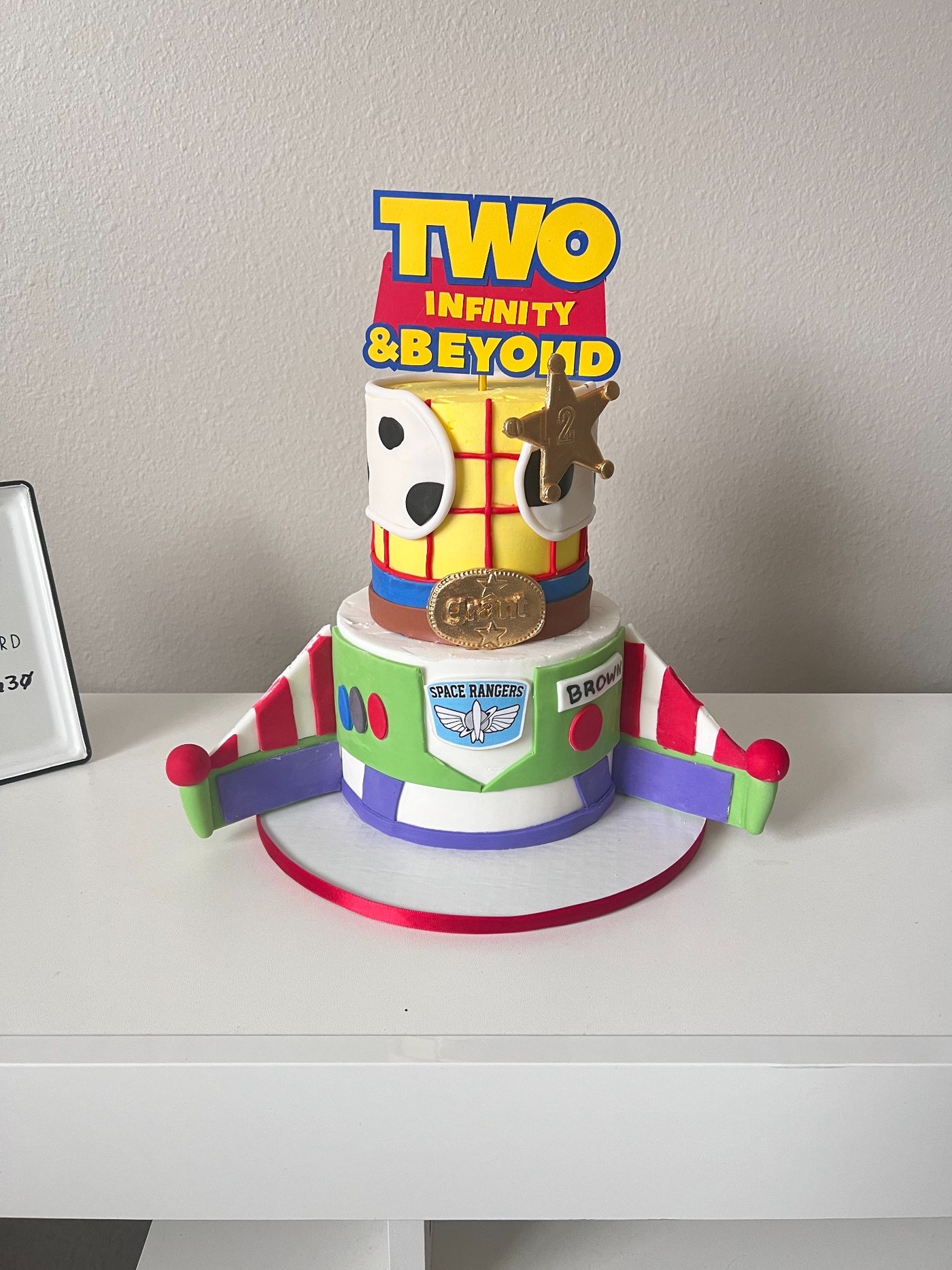 Toy themed two tier cake