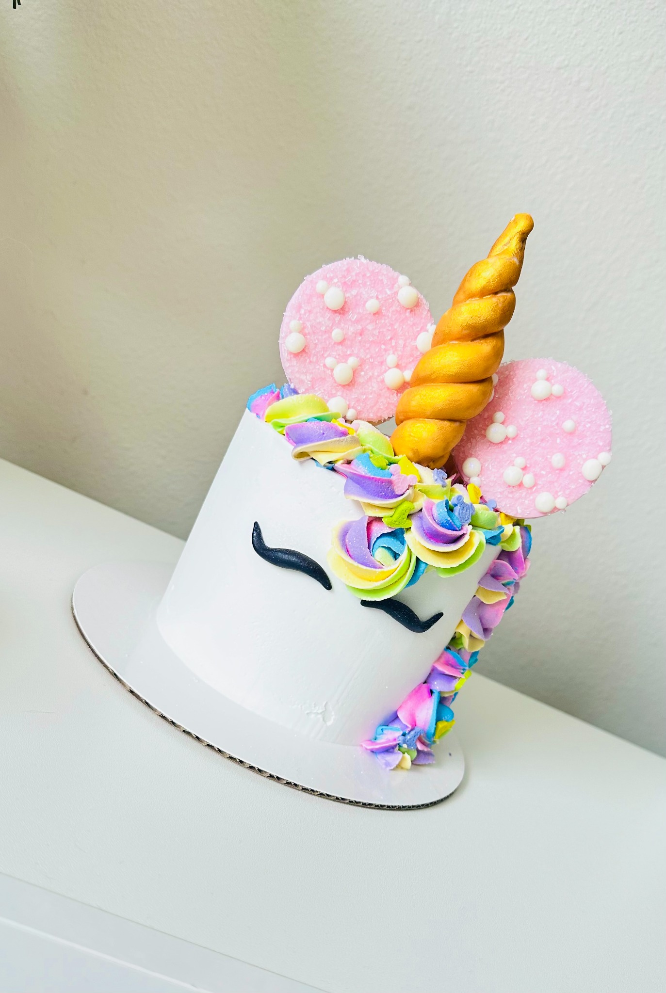 White unicorn cake with pastel buttercream mane